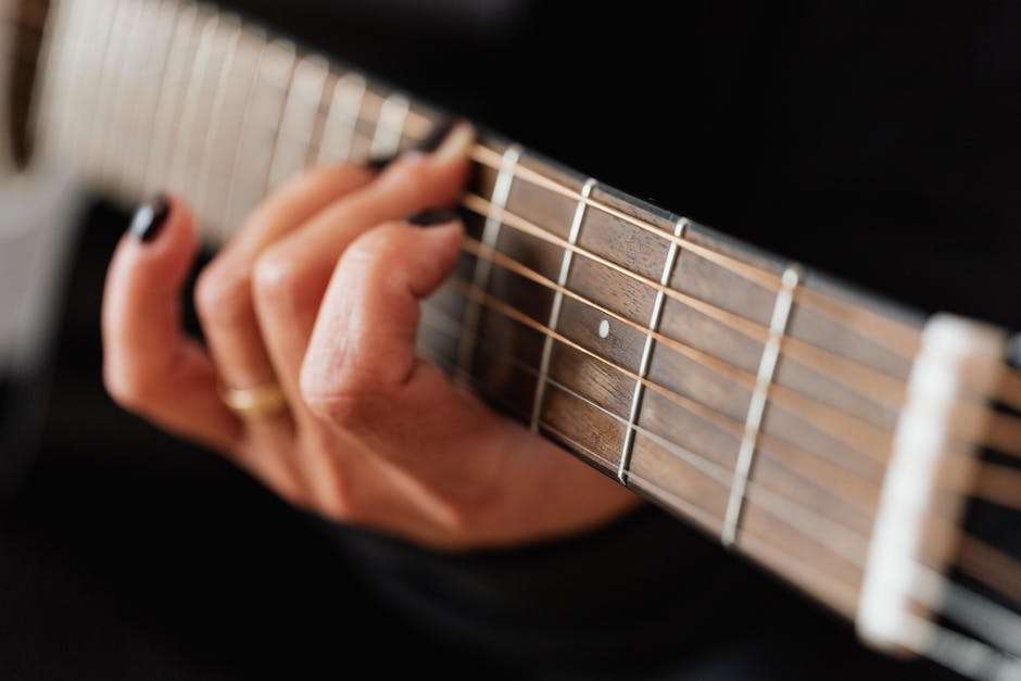Image of various guitar playing techniques, showcasing different hand positions and styles.