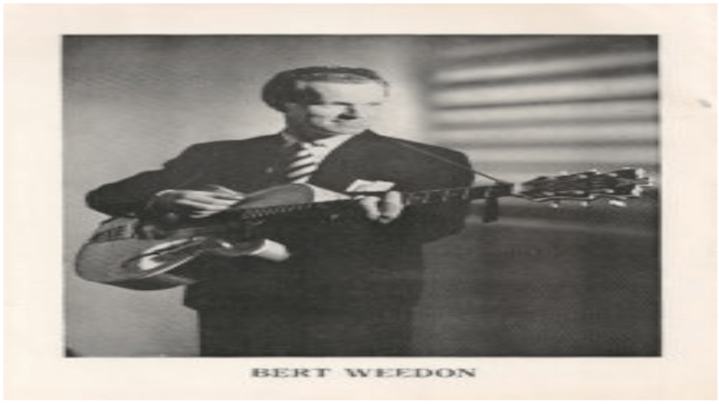 Black And White Photo Of Bert Weedon Playing A Guitar.